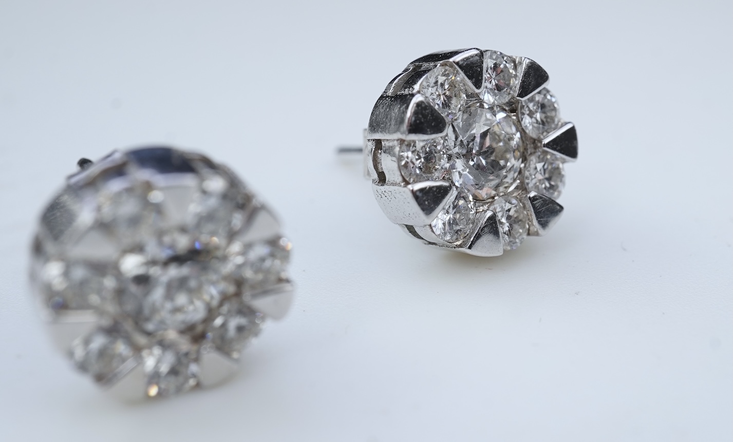 A pair of diamond stud earrings
